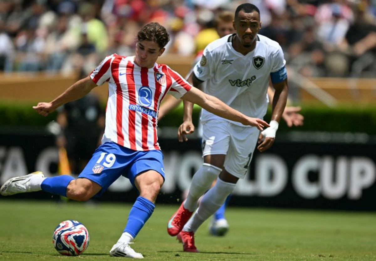 Atletico Madrid's Argentine forward #19 Julian Alvarez and Botafogo's Brazilian midfielder #17 Marlon Freitas fight for the ball during the FIFA Club World Cup 2025 Group B football match between Spain's Atletico de Madrid and Brazil's Botafogo at the Rose Bowl stadium in Los Angeles on June 23, 2025.  YURI CORTEZ / AFP