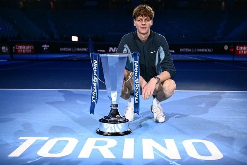 Italy's Jannik Sinner poses with the trophy after winning the final against USA's Taylor Fritz at the ATP Finals tennis tournament in Turin on November 17, 2024.  Marco BERTORELLO / AFP