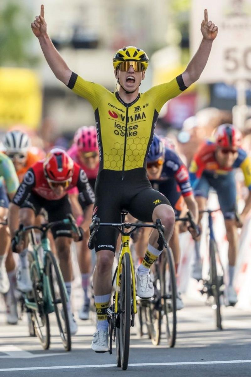 Great Britain's James Brennan (Visma) crosses the finish line to win the first stage of the Tour of Romandie UCI cycling World tour, 194.3 km from Munchenstein to Saint-Imier to Fribourg, on April 29, 2025.  Fabrice COFFRINI / AFP
