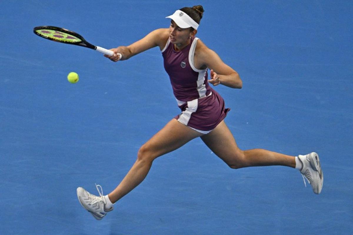 Belgium's Elise Mertens hits a return to China's Zheng Qinwen during their women's singles semi-final at the China Open tennis tournament in Beijing on October 10, 2026.  Pedro Pardo / AFP