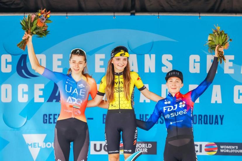 (L-R) Second-placed UAE Team Adq's Dominika Wlodarczyk of Poland, winner Team Visma Lease A Bike Women's Rosita Reijnhout of the Netherlands, and third-placed Team FDJ Suez's Cecilie Ludwig of Denmark celebrate on the podium during the award ceremony of the 2024 Women's Elite Cadel Evans Great Ocean Road Race cycling event in Geelong on January 27, 2024.  CHRIS PUTNAM / AFP
