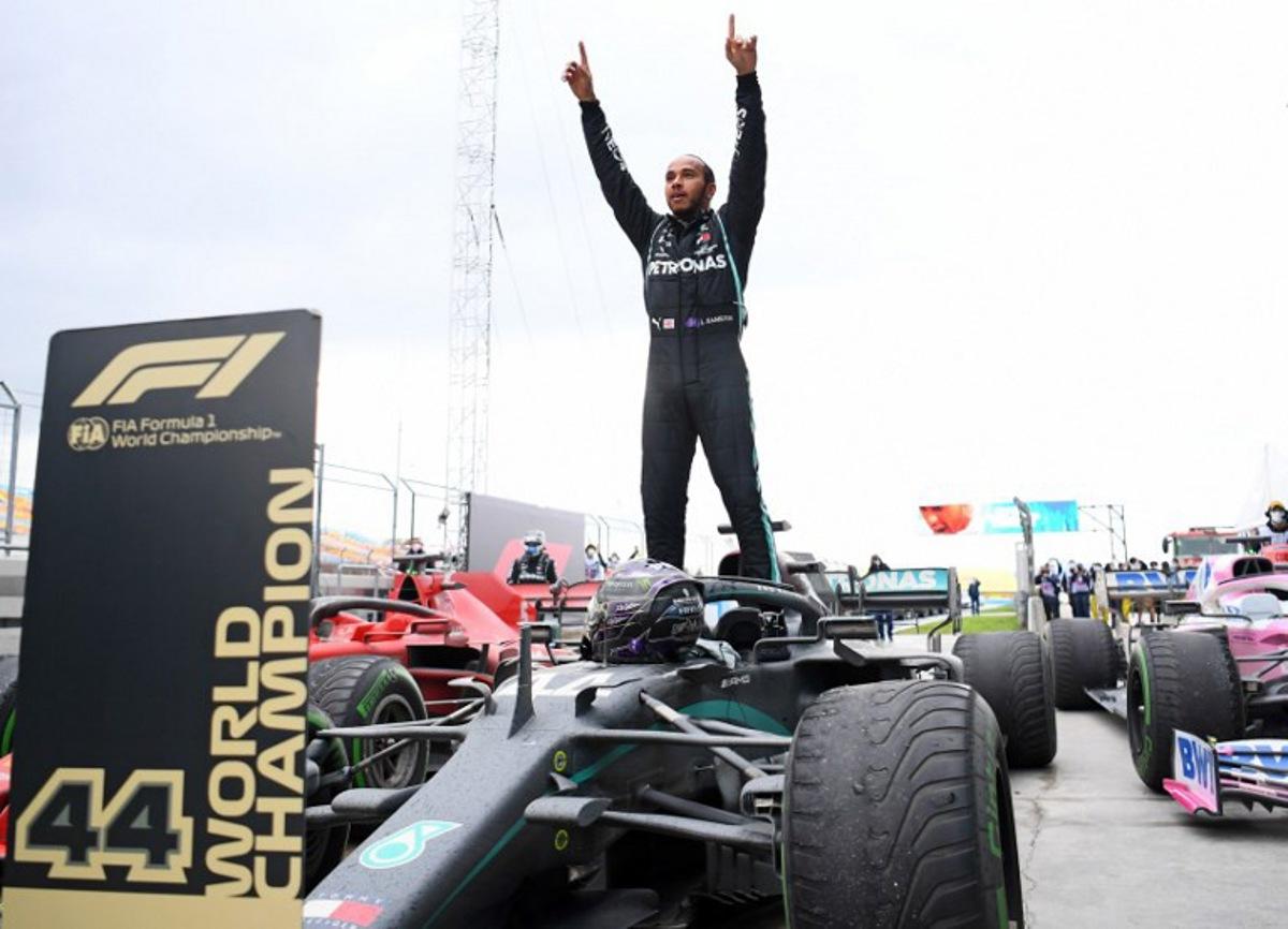 Mercedes' British driver Lewis Hamilton reacts as he gets out of his car after winning the Turkish Formula One Grand Prix at the Intercity Istanbul Park circuit in Istanbul on November 15, 2020. Lewis Hamilton won the race to seal his 7th World Championship. Clive Mason / POOL / AFP
