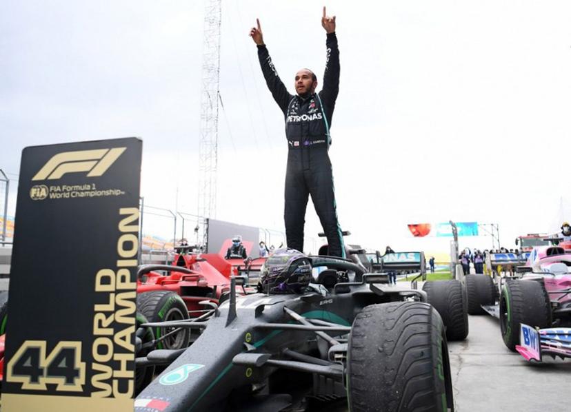 Mercedes' British driver Lewis Hamilton reacts as he gets out of his car after winning the Turkish Formula One Grand Prix at the Intercity Istanbul Park circuit in Istanbul on November 15, 2020. Lewis Hamilton won the race to seal his 7th World Championship. Clive Mason / POOL / AFP