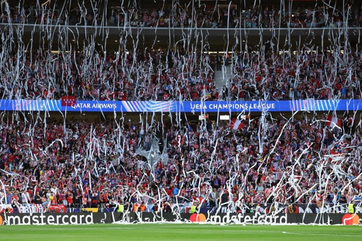 Atletico Madrid fans throw toilet paper before the UEFA Champions League semi-final first leg football match between Club Atletico de Madrid and Arsenal at the Metropolitano stadium in Madrid on April 29, 2026.  Thomas COEX / AFP