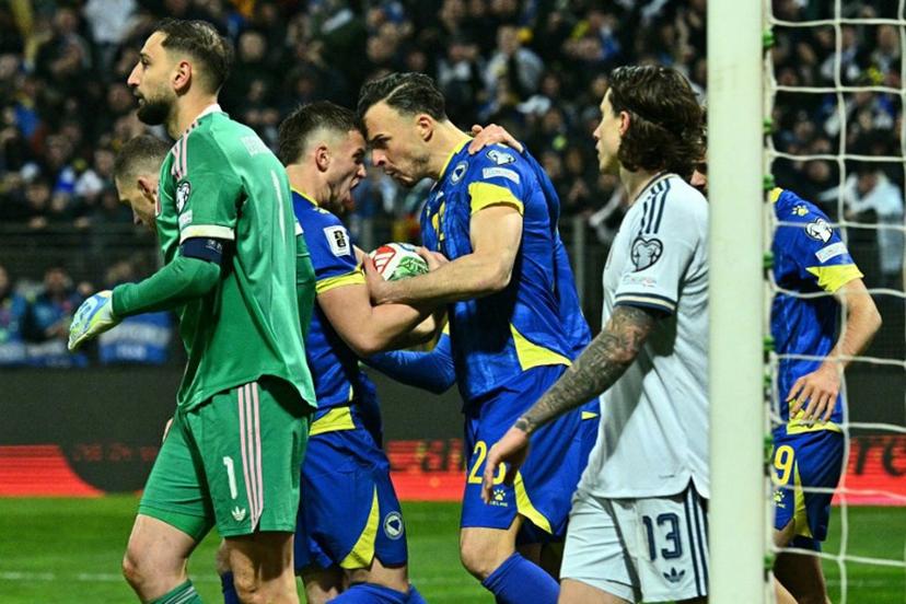 Bosnia-Herzegovina's forward #23 Haris Tabakovic (C) celebrates with teammates after scoring during the FIFA World Cup 2026 European qualification final football match between Bosnia-Herzegovina and Italy at the Bilino-Polje stadium in Zenica on March 31, 2026.   Elvis BARUKCIC / AFP