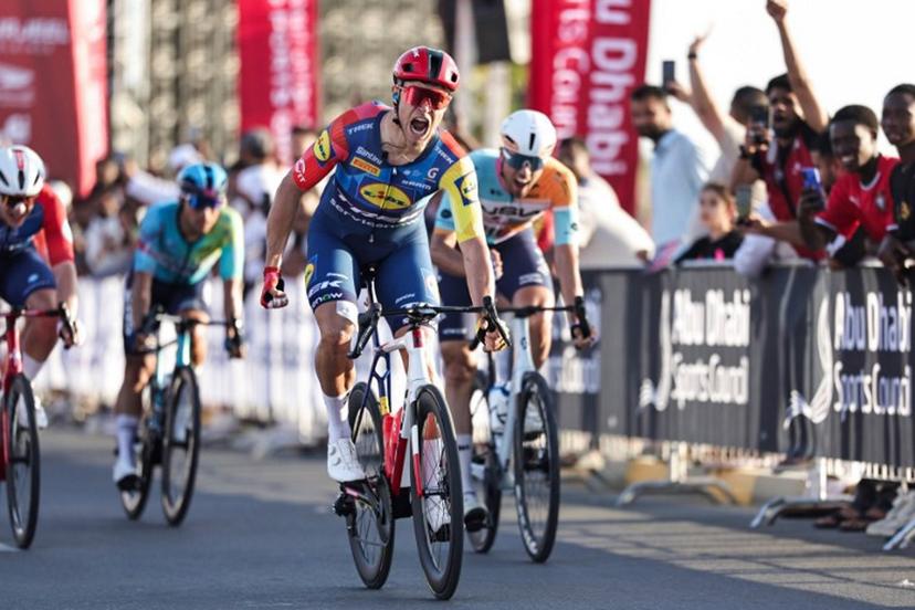 Lidl-Trek's Italian rider Jonathan Milan reacts after crossing the finish line first during the fourth stage of the UAE Tour cycling event in al-Fujairah on February 19, 2026.  Fadel SENNA / AFP