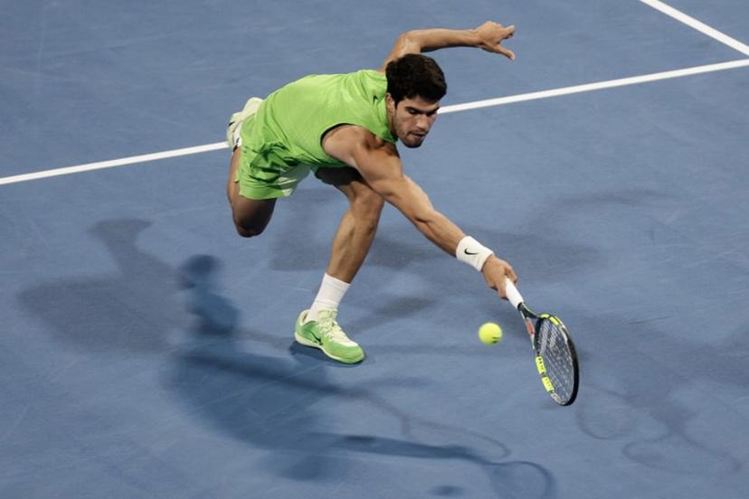 Spain's Carlos Alcaraz hits a return against France's Arthur Fils during their men's singles final match at the Qatar Open tennis tournament in Doha on February 21, 2026.  Karim JAAFAR / AFP