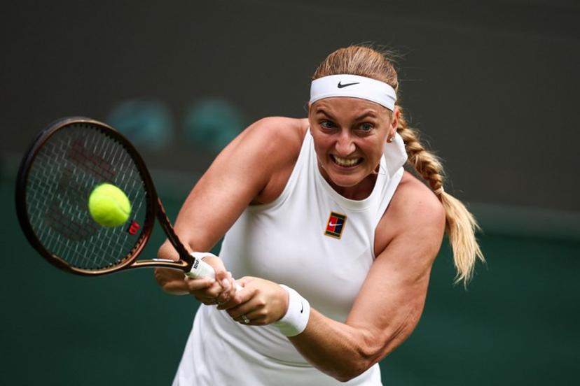 Czech Republic's Petra Kvitova returns the ball to US player Emma Navarro during their women's singles first round tennis match on the second day of the 2025 Wimbledon Championships at The All England Lawn Tennis and Croquet Club in Wimbledon, southwest London, on July 1, 2025.  HENRY NICHOLLS / AFP