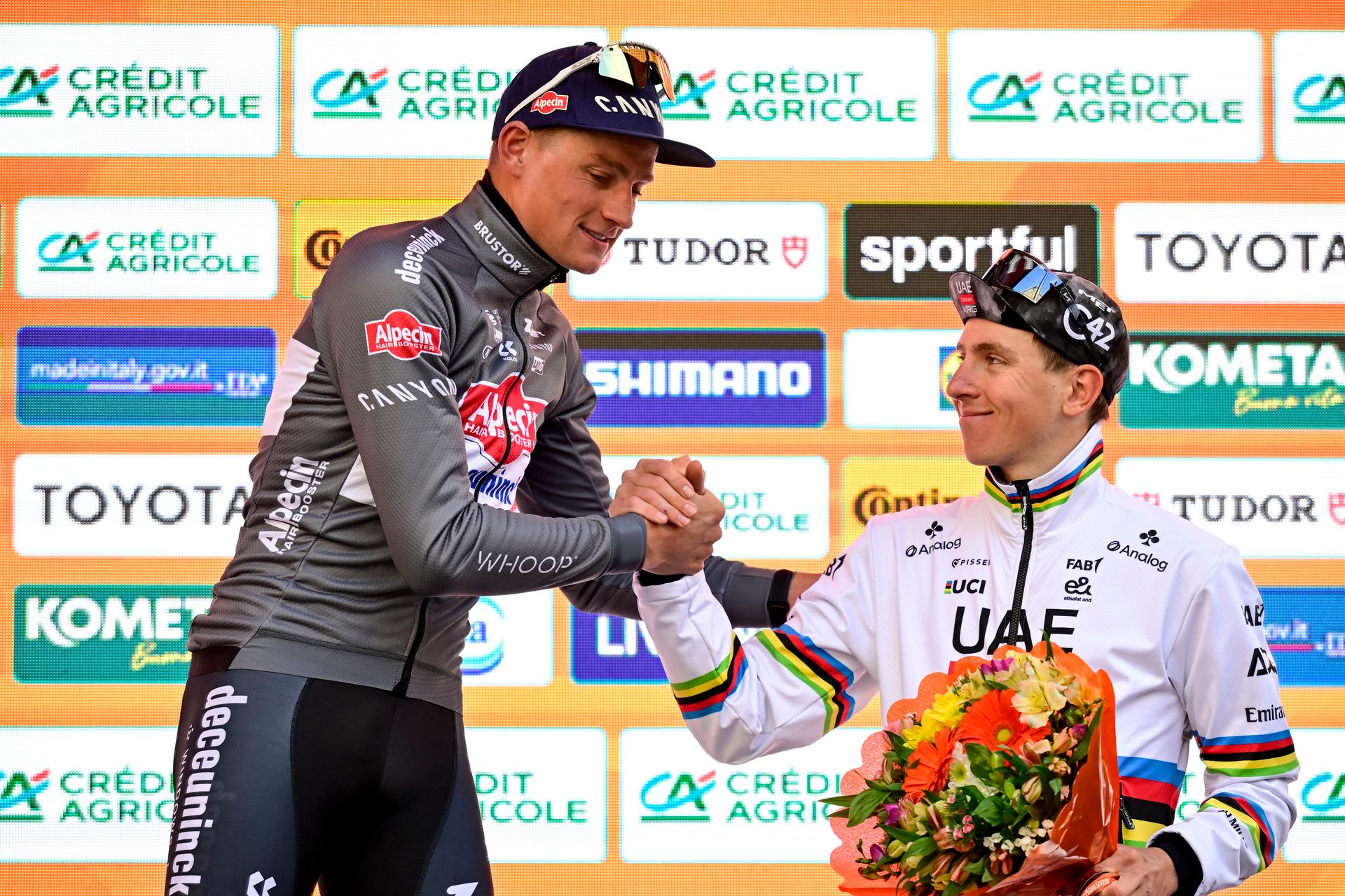 Dutch Mathieu van der Poel of Alpecin-Deceuninck and Slovenian Tadej Pogacar of UAE Team Emirates pictured on the podium after the 'Milano-Sanremo' one day cycling race for men, 289km from Milan to Sanremo, Italy, Saturday 22 March 2025. BELGA PHOTO DIRK WAEM