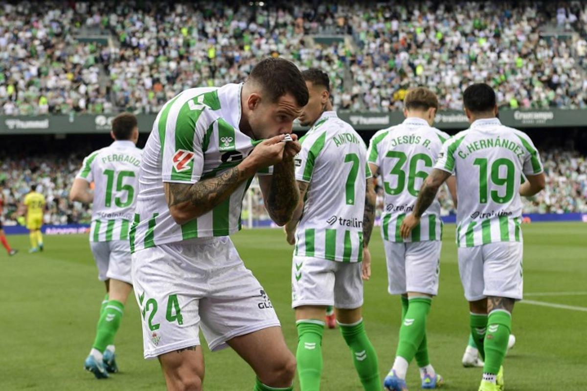 Real Betis' Spanish defender #24 Aitor Ruibal Garcia celebrates scoring their first goal during the Spanish league football match between Real Betis and Villarreal CF at the Benito Villamarin stadium in Seville on April 13, 2025.  CRISTINA QUICLER / AFP