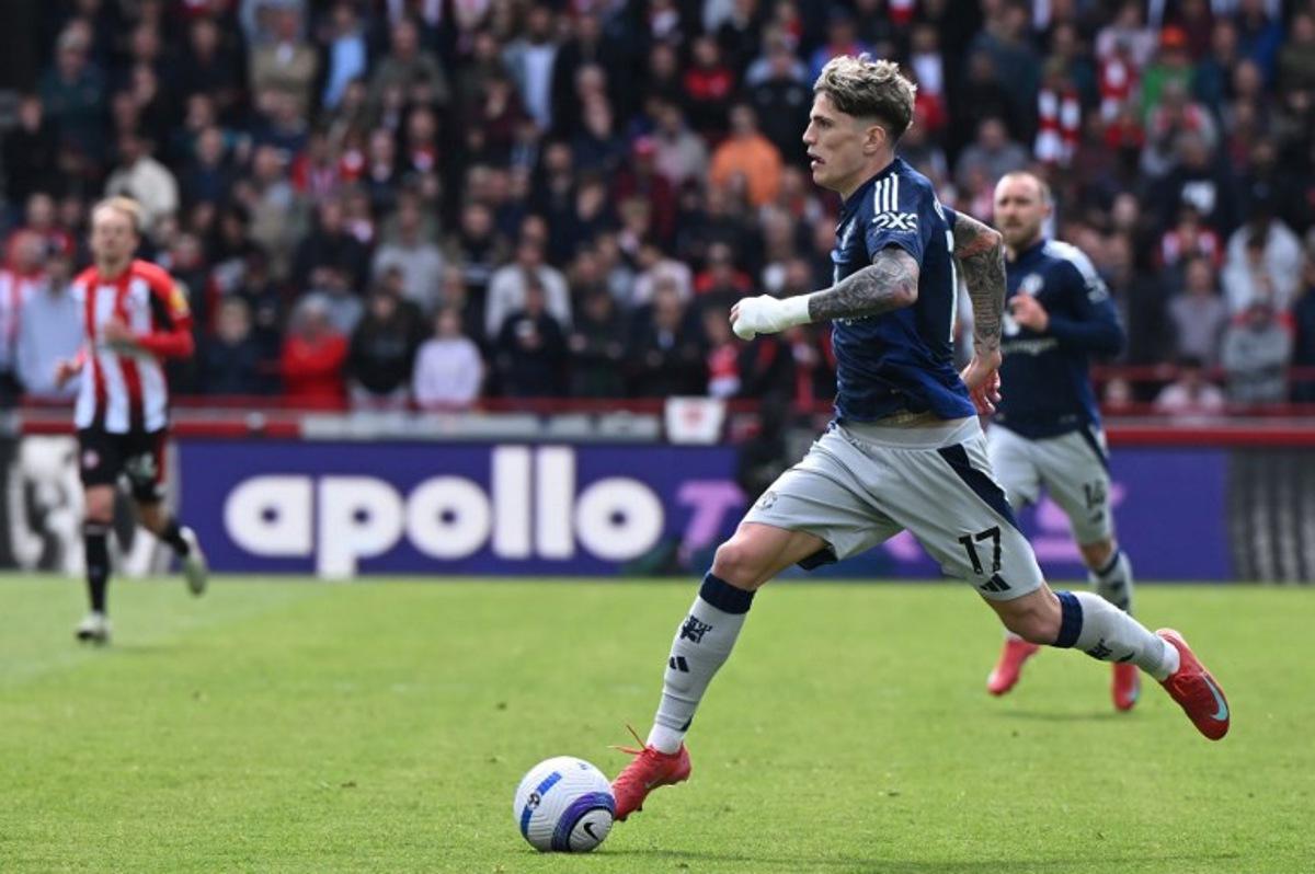 Manchester United's Argentinian midfielder #17 Alejandro Garnacho runs with the ball during the English Premier League football match between Brentford and Manchester United at the Gtech Community Stadium in London on May 4, 2025.  JUSTIN TALLIS / AFP