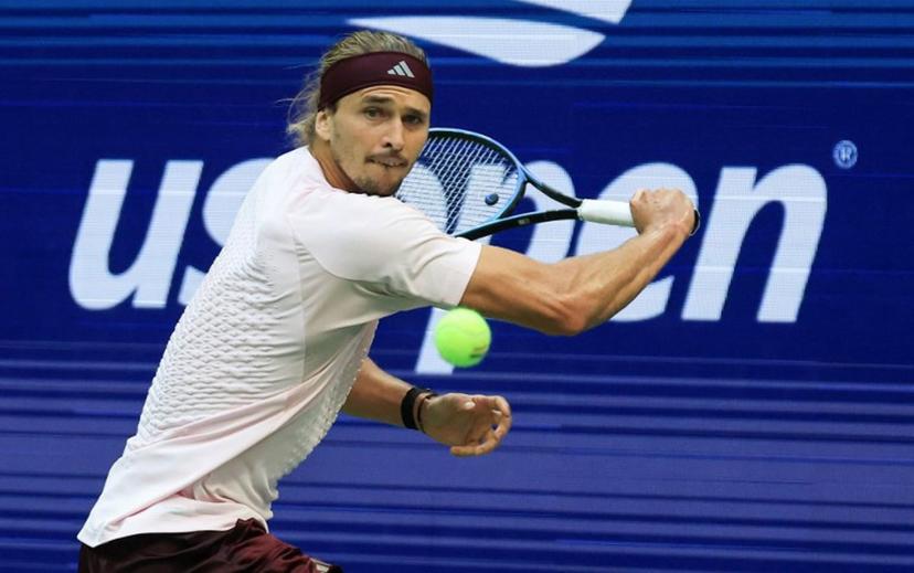 Germany's Alexander Zverev returns the ball to Russia's Karen Khachanov during the men's singles semi-final tennis match on day thirteen of the US Open tennis tournament at the USTA Billie Jean King National Tennis Center in New York City on September 11, 2026.  TIMOTHY A. CLARY / AFP