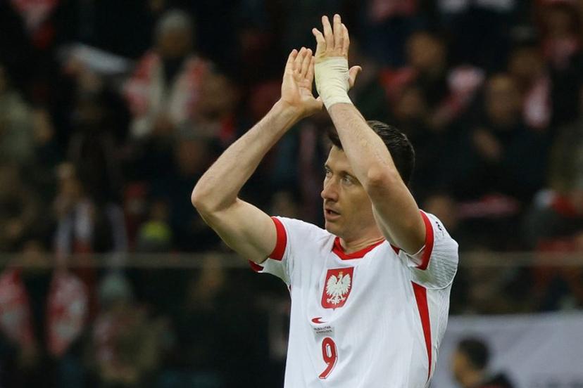 Poland's forward #09 Robert Lewandowski applauds as he goes off during the 2026 FIFA World Cup qualifiers football match between Poland and Lithuania at the National Stadium in Warsaw, Poland on November 21, 2024.  Wojtek RADWANSKI / AFP