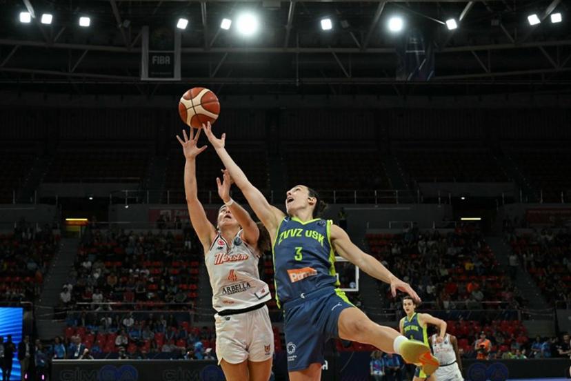 CBK Mersin's French pointguard #04 Marine Fauthoux and Prague's Slovak shooting guard #03 Teja Oblak reach for the ball during the Euroleague Women's final basketball match between CIMSA CBK Mersin and ZVVZ USK Prague at the Pabellon Principe Felipe arena in Zaragoza on April 13, 2025.  JAVIER SORIANO / AFP