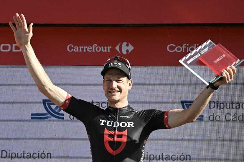 Team Tudor Pro Cycling Team's Swiss rider Stefan Kung celebrates on the podium after winning the 18th stage of the Vuelta a Espana 2026 cycling tour, a 32,1 km individual time-trial race between El Puerto de Santa Maria and Jerez de la Frontera, on September 10, 2026.   JORGE GUERRERO / AFP