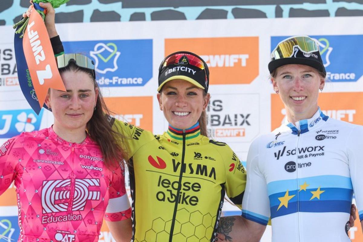 Second placed EF Education-Oatly's Italian rider Letizia Borghesi (L), First placed Team Visma-Lease a Bike's French rider Pauline Ferrand Prevot and SD Worx-Protime's Dutch rider Lorena Wiebes celebrate on the podium of the fifth edition of the Paris-Roubaix women's race, 148,5 km between Denain and Roubaix, northern France on April 12, 2025.  Francois LO PRESTI / AFP
