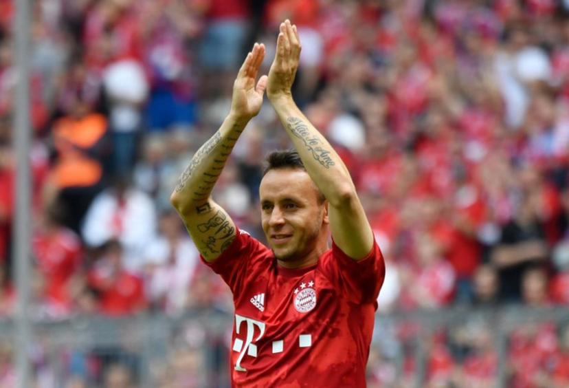 (FILES) Bayern Munich's Brazilian defender Rafinha cheers after his last match with Bayern after  the German First division Bundesliga football match FC Bayern Munich v Eintracht Frankfurt in Munich, southern Germany, on May 18, 2019. Rafinha announced at the age of 39 his retirement as a footballer on July 21, 2025. The Brazilian player won the Champions League with Bayern Munich and the Copa Libertadores with Flamengo. John MACDOUGALL / AFP
