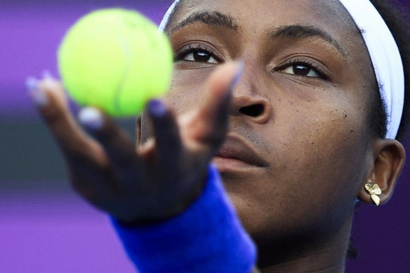 US' Coco Gauff serves against Italy's Elisabetta Cocciaretto during  their women's singles match at the Qatar Open tennis tournament in Doha on February 10, 2026.  Karim JAAFAR / AFP