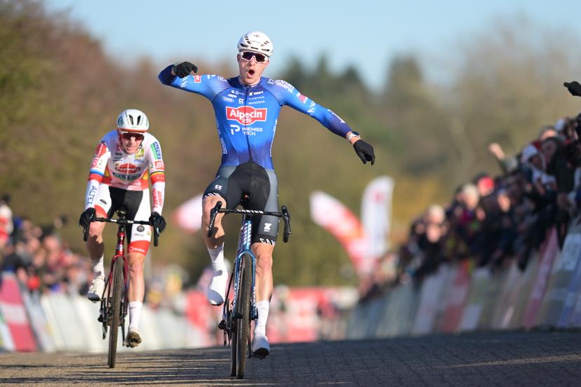 Belgian Niels Vandeputte celebrates as he crosses the finish line to win, before Belgian Michael Vanthourenhout (L) the sprint at the finish of the elite men race of the 'Waaslandcross' cyclocross cycling event, Saturday 14 February 2026 in Sint-Niklaas, the seventh and last race of the Exact Cross competition. BELGA PHOTO DAVID PINTENS