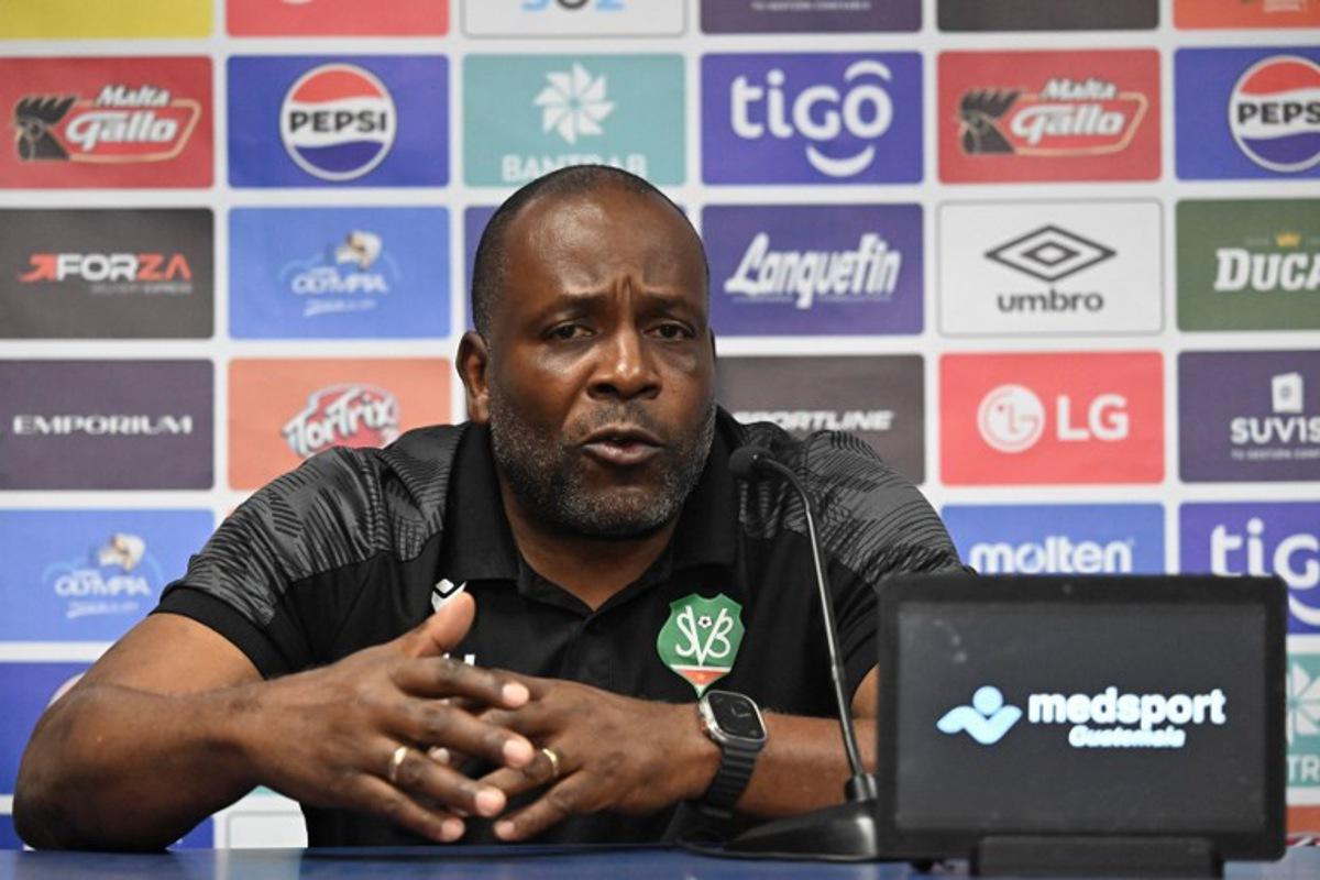 Suriname's head coach Stanley Menzo speaks during a press conference at Manuel Felipe Carrera stadium in Guatemala City on November 17, 2025, ahead of the FIFA World Cup 2026 qualifier football match against Guatemala.  JOHAN ORDONEZ / AFP