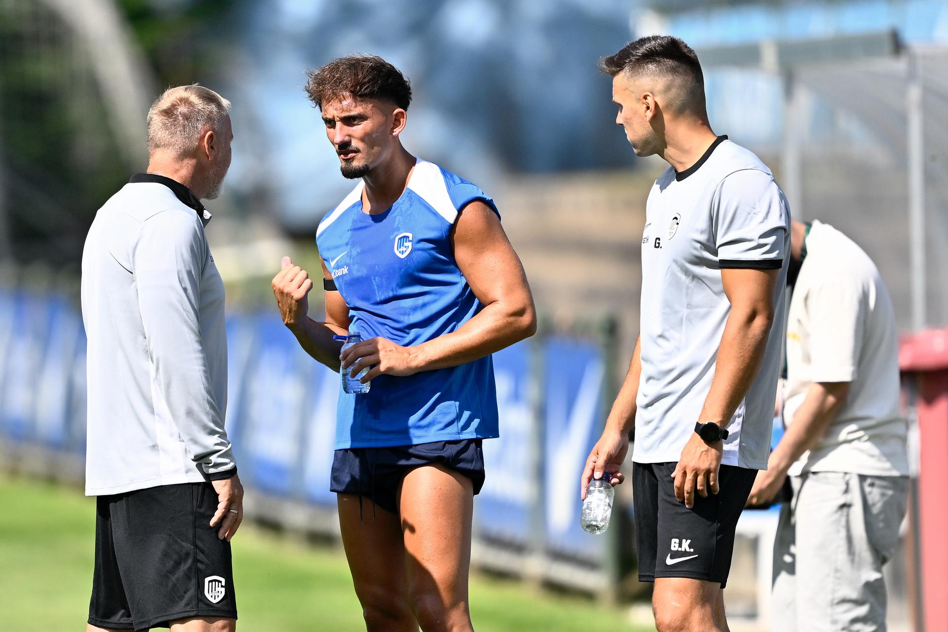 Genk's head coach Thorsten Fink, Genk's Andi Zeqiri and Genk's physical coach Goran Kontic pictured during a training session of Belgian soccer team KRC Genk, Friday 20 June 2025 in Genk, in preparation of the upcoming 2025-2026 Belgian first division soccer season. BELGA PHOTO JOHAN EYCKENS