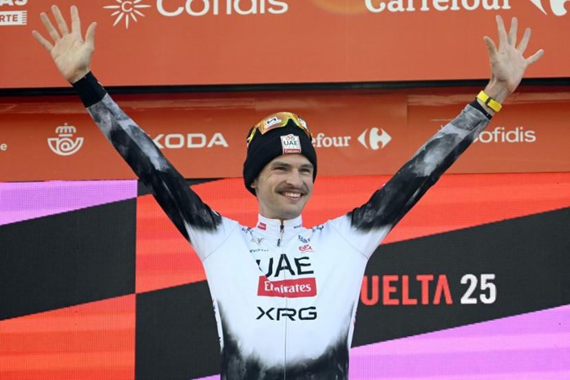 Team UAE's Australian rider Jay Vine celebrates on the podium after winning the sixth stage of La Vuelta a Espana cycling tour, a 170 km race between Olot and Pal, in Andorra, on August 28, 2025.    Josep LAGO / AFP