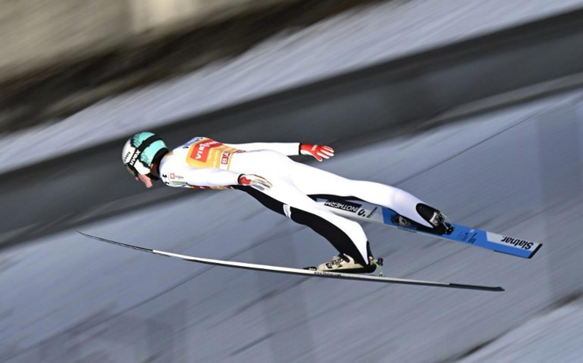 Slovenia's Domen Prevc soars through the air during the trial round ahead of the Men's Individual Large Hill HS142 event of the FIS Ski Jumping World Cup, the second leg of the Four Hills Tournament, in Garmisch-Partenkirchen, southern Germany on January 1, 2026.  PHILIPP GUELLAND / AFP