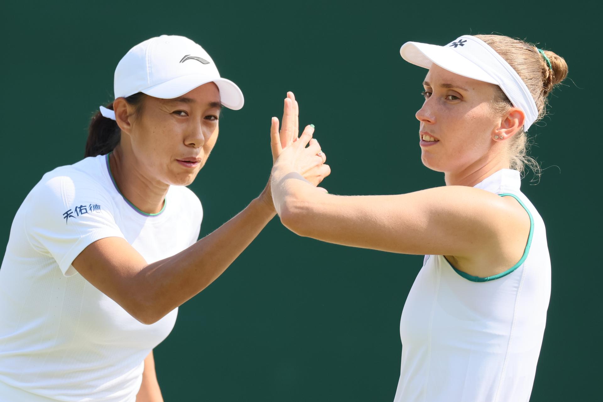 Chinese Tianhui Zhang and Belgian Elise Mertens pictured during a doubles tennis match between Romanian pair Cristian-Begu and Belgian-Chinese pair Mertens-Zhang, in the first round of the Women's doubles at the Wimbledon grand slam tennis tournament in London, Britain, Friday 03 July 2026.  BELGA PHOTO BENOIT DOPPAGNE