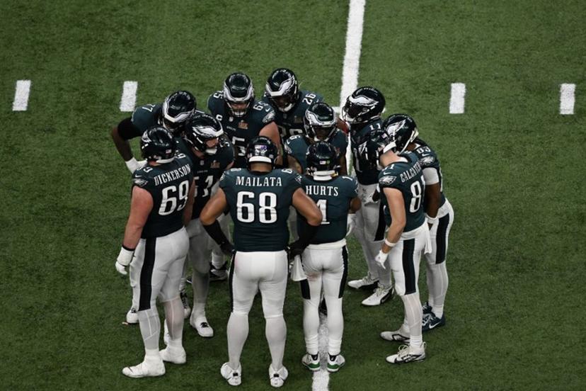 Philadelphia Eagles' quarterback #01 Jalen Hurts gathers the Eagles in the huddle during Super Bowl LIX between the Kansas City Chiefs and the Philadelphia Eagles at Caesars Superdome in New Orleans, Louisiana, February 9, 2025.  Chandan Khanna / AFP