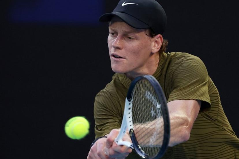 Italy's Jannik Sinner hits a return to France's Hugo Gaston during their men's singles match on day three of the Australian Open tennis tournament in Melbourne on January 20, 2026.  Martin KEEP / AFP