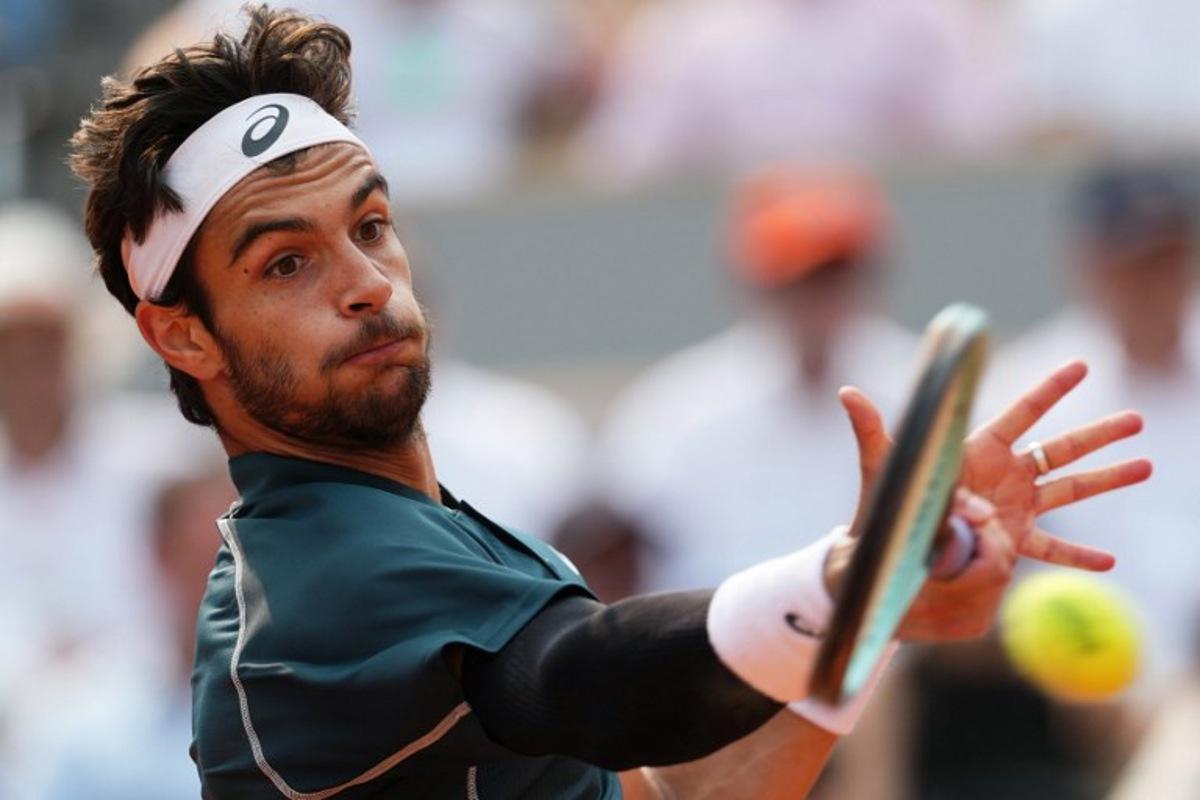 Italy's Lorenzo Musetti plays a forehand return to US Frances Tiafoe during their men's singles quarter-final match on day 10 of the French Open tennis tournament on Court Philippe-Chatrier at the Roland-Garros Complex in Paris on June 3, 2025.  Dimitar DILKOFF / AFP