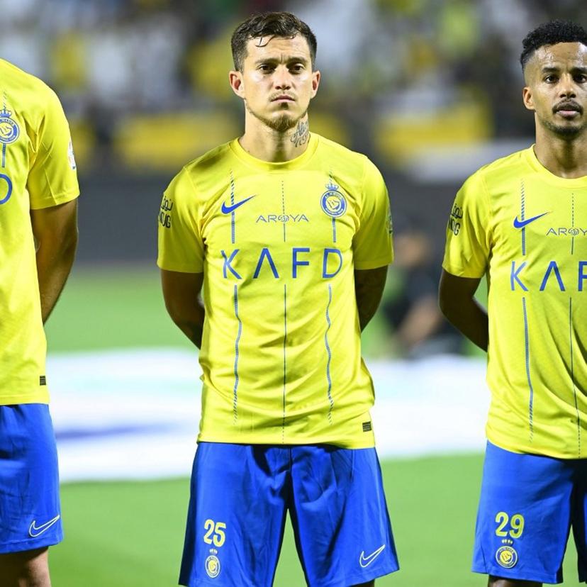 Nassr's Portuguese forward #25 Otavio and Nassr's Saudi midfielder #29 Abdulrahman Ghareebthe stand before the Saudi Pro League football match between Al-Nassr and Al-Fateh at the Prince Abdullah Bin Jalawi Stadium in al-Hasa, on August 25, 2023.  Ali Al-HAJI / AFP