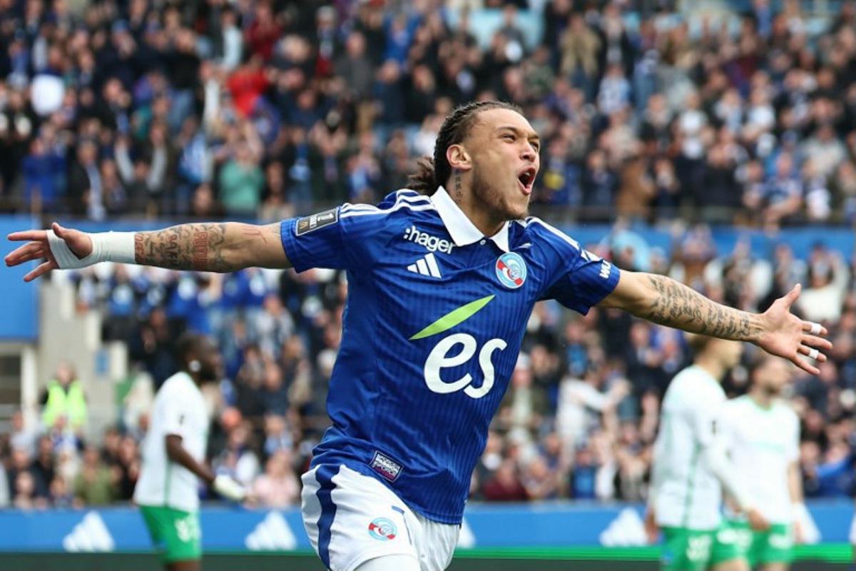 Strasbourg's Belgian-Portuguese forward #07 Diego Moreira celebrates after scoring a goal during the French L1 football match between RC Strasbourg Alsace and AS Saint-Etienne at Stade de la Meinau in Strasbourg, north-eastern France on April 26, 2025.   Frederick FLORIN / AFP