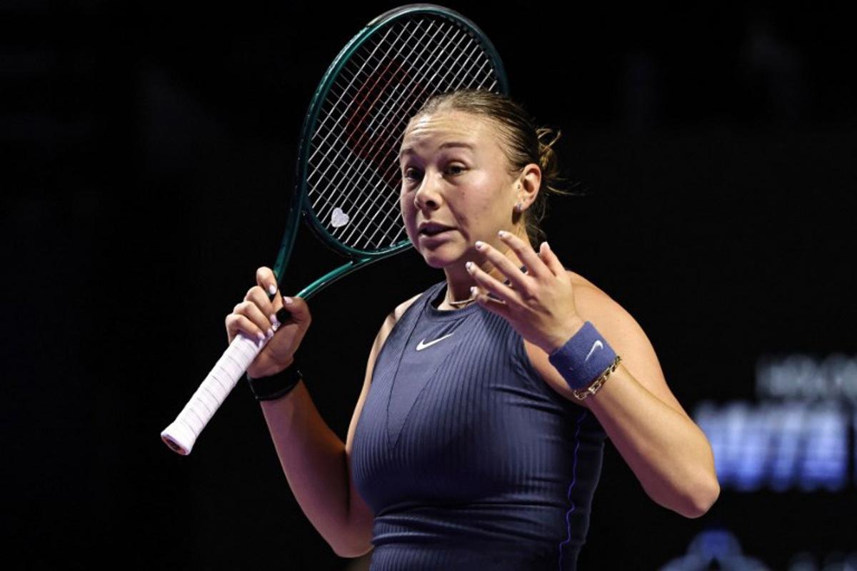 US' Amanda Anisimova reacts after a point against Poland's Iga Swiatek during their WTA Finals tennis tournament in Riyadh on November 5, 2025.  Fayez NURELDINE / AFP
