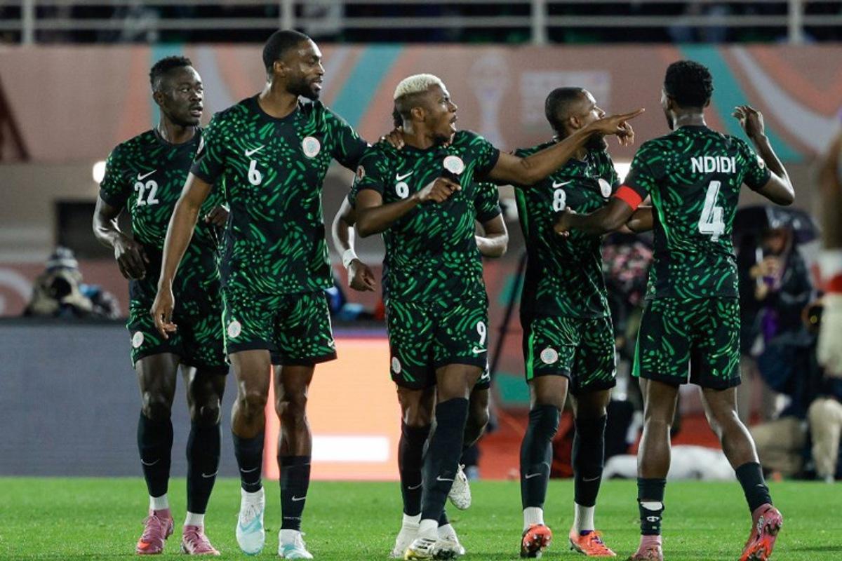 Nigeria's forward #09 Victor Osimhen (C) celebrates his goal during the Africa Cup of Nations (CAN) Group C football match between Nigeria and Tunisia at Fez Stadium in Fez on December 27, 2025.   Abdel Majid BZIOUAT / AFP