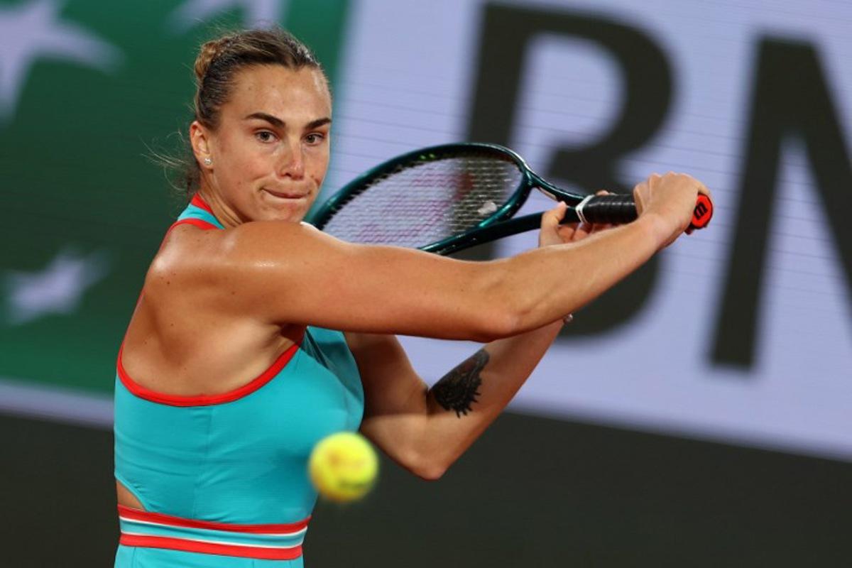 Belarus' Aryna Sabalenka plays a backhand return to Russia's Kamilla Rakhimova during their women's singles match on day 1 of the French Open tennis tournament on Court Philippe-Chatrier at the Roland-Garros Complex in Paris on May 25, 2025.  Alain JOCARD / AFP