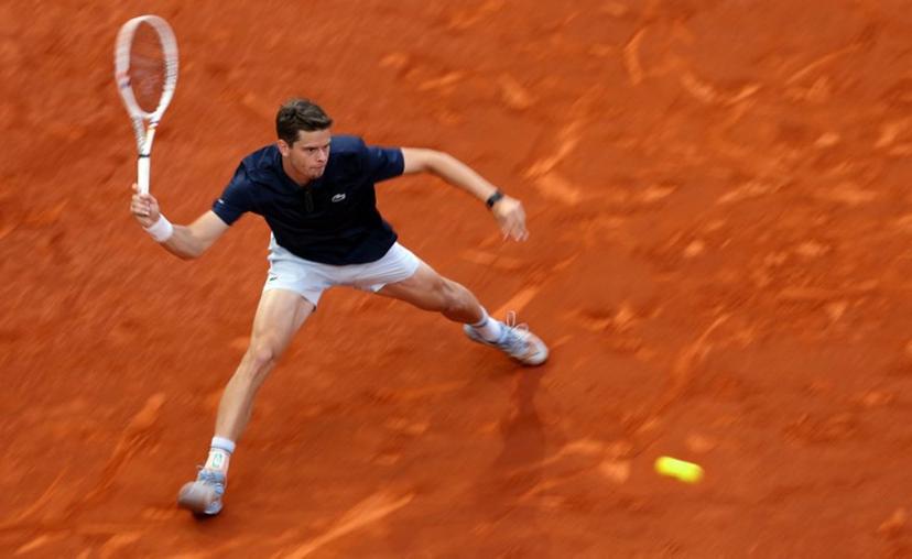Belgium's Alexander Blockx returns the ball to Germany's Alexander Zverev during their 2026 ATP Tour Madrid Open tennis tournament semi-final singles match at the Caja Magica in Madrid, on May 1, 2026.  Thomas COEX / AFP