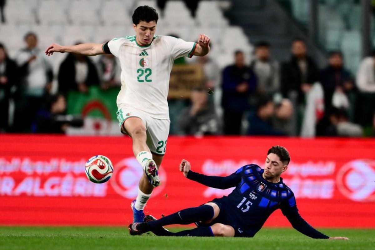 Algeria's midfielder #22 Ibrahim Maza (L) fights for the ball with Uruguay's midfielder #15 Federico Valverde (R) during the friendly international football match between Algeria and Uruguay at the Allianz Stadium in Turin on March 31, 2026.  MARCO BERTORELLO / AFP