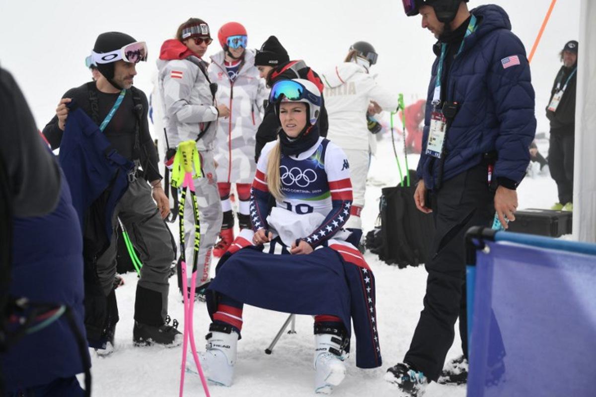 USA's Lindsey Vonn waits in the start area during a race suspension due to fog on the course, in the second official training for the women's downhill event ahead of the Milano Cortina 2026 Winter Olympic Games at the Tofane Alpine Skiing Centre in Cortina d'Ampezzo on February 6, 2026.  Marco BERTORELLO / AFP