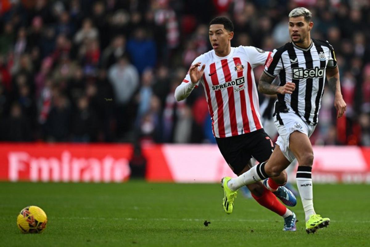 Sunderland's English midfielder #07 Jobe Bellingham (L) vies with Newcastle United's Brazilian midfielder #39 Bruno Guimaraes (R) during the English FA Cup third round football match between Sunderland and Newcastle United at The Stadium of Light in Sunderland in north east England on January 6, 2024.  Paul ELLIS / AFP