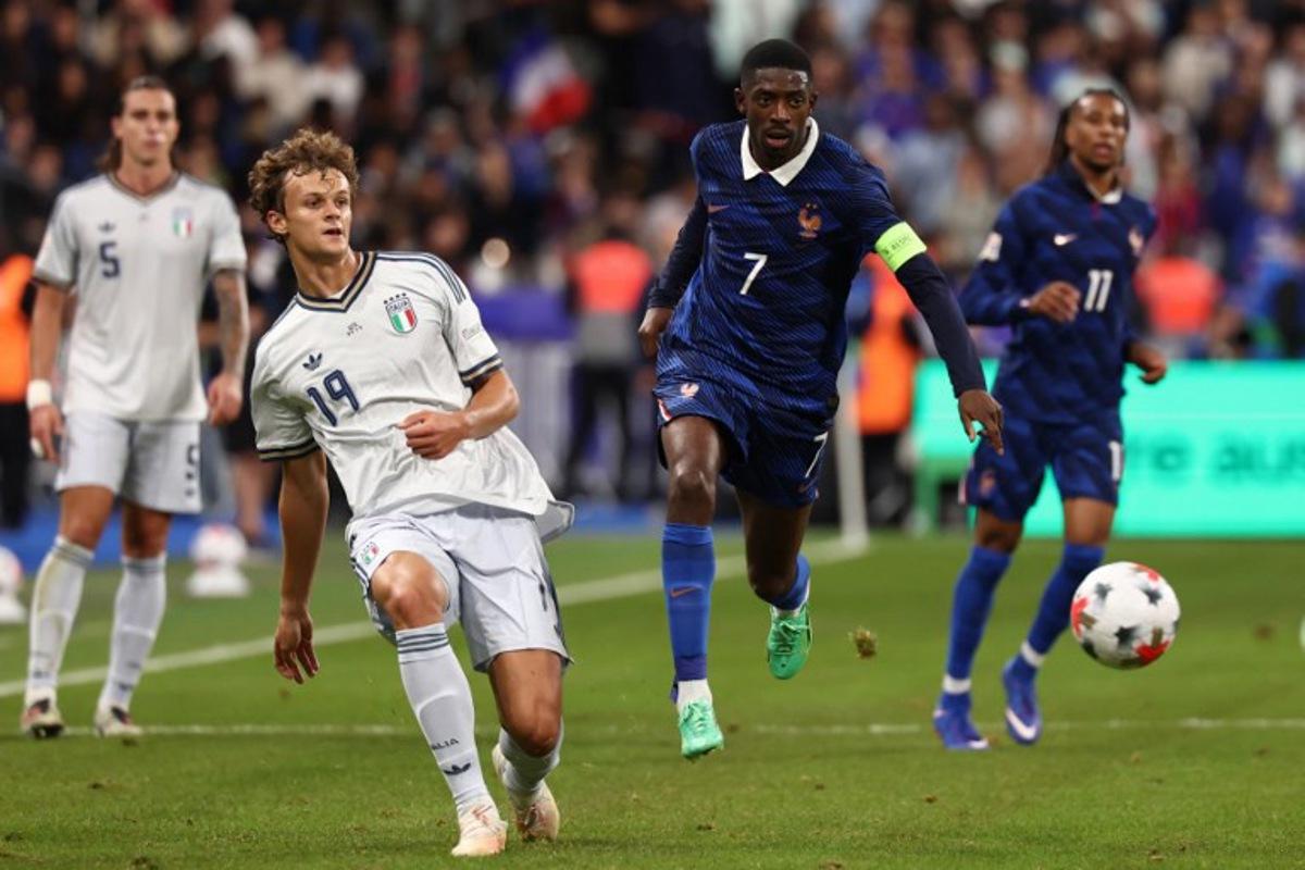 France's forward #07 Ousmane Dembele (R) and Italy's defender #19 Giorgio Scalvini (L) watch the ball during the UEFA Nations League, league A day 3: Group 1, football match between France and Italy at the Stade de France stadium in Saint-Denis, near Paris, on October 2, 2026.  FRANCK FIFE / AFP