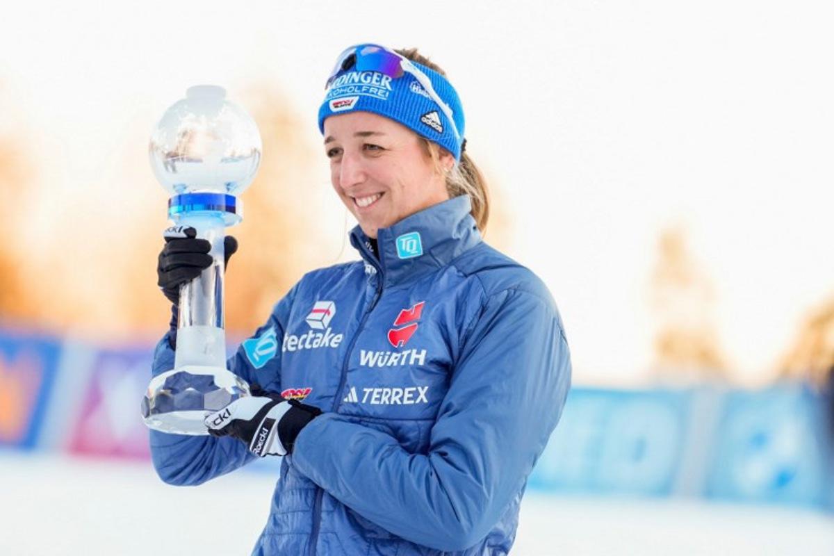 Winner Germany's Franziska Preuss celebrates with the trophy after the women's 7,5km Biathlon sprint in the World Cup in Holmenkollen on March 21, 2025.   Javad Parsa / NTB / AFP