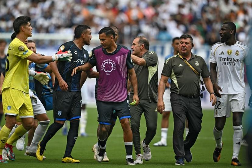 Real Madrid's German defender #22 Antonio Ruediger (R) argues with Pachuca's Argentine defender #22 Gustavo Cabral (2ndL) during the FIFA Club World Cup 2025 Group H football match between Spain's Real Madrid and Mexico's Pachuca at the Bank of America stadium in Charlotte on June 22, 2025. Real Madrid coach Xabi Alonso said his defender Antonio Rudiger had complained of a racist incident at the end of Sunday's 3-1 Club World Cup win over Mexican side Pachuca. Rudiger was visibly angered following an exchange of words with Pachuca's Gustavo Cabral after the final whistle and spoke to Brazilian referee Ramon Abatti Abel. Paul ELLIS / AFP