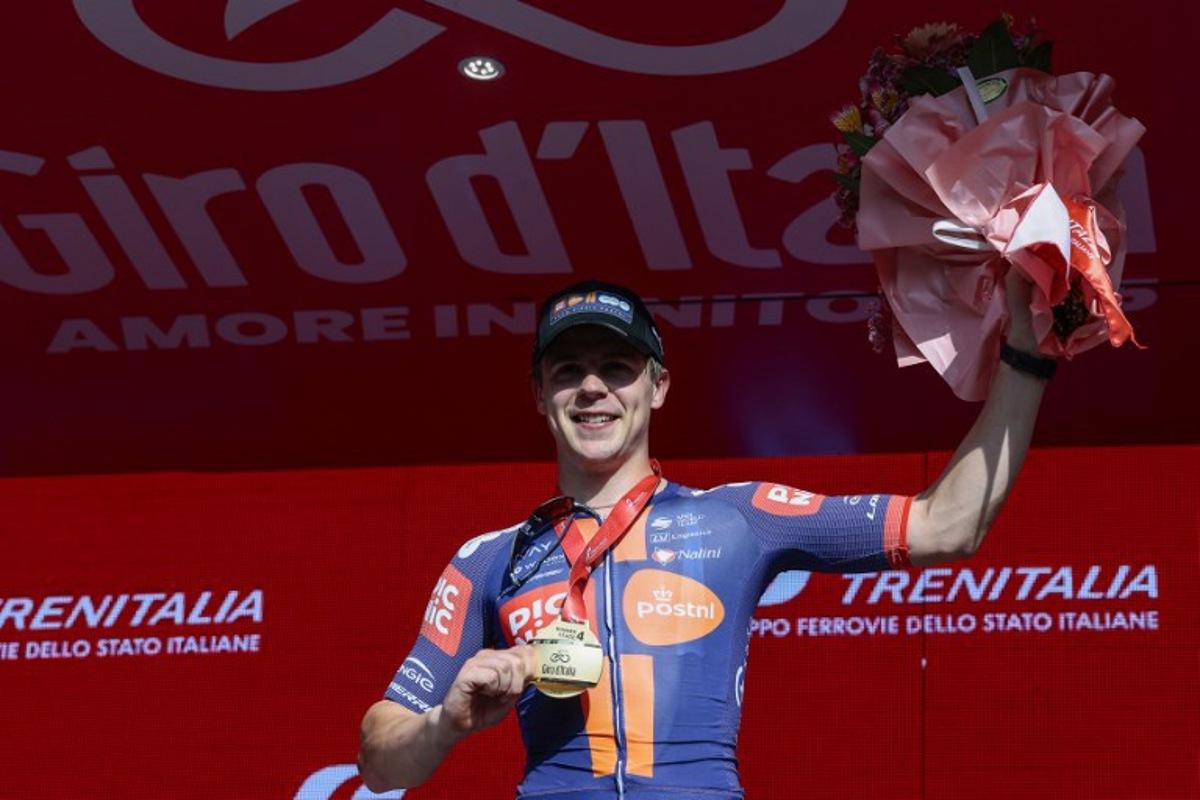 Team Picnic PostNL's Dutch rider Casper Van Uden celebrates on the podium after winning the 4th stage of the 108th Giro d'Italia cycling race 189kms from Alberobello to Lecce on May 13, 2025.  Luca Bettini / AFP