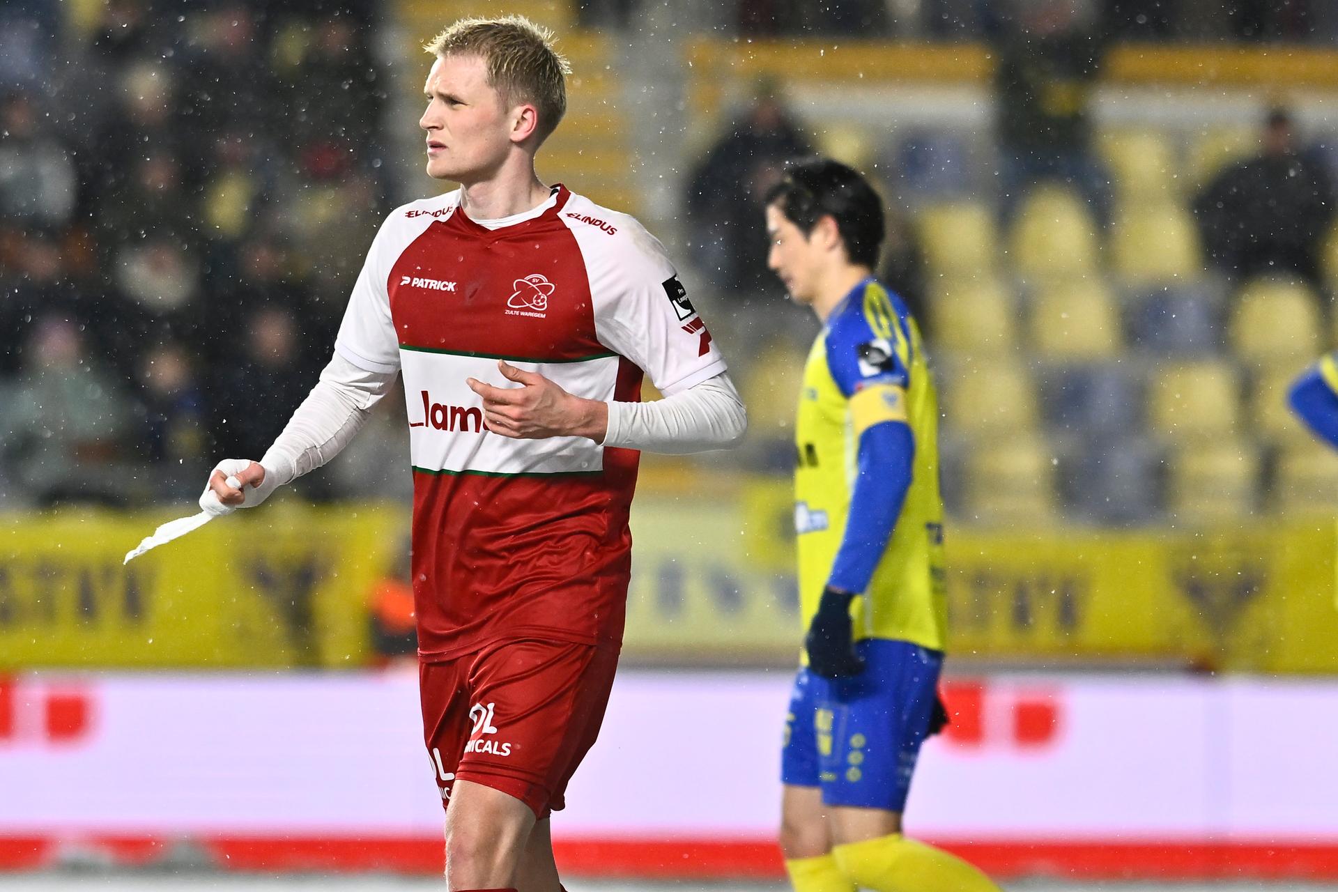 Essevee's Jakob Kiilerich receives a yellow card from and referee Nathan Verboomen a soccer match between Sint-Truidense V.V. and Zulte Waregem, Sunday 15 February 2026 in Sint-Truiden, on day 25 of the 2025-2026 'Jupiler Pro League' first division of the Belgian championship. BELGA PHOTO JOHAN EYCKENS