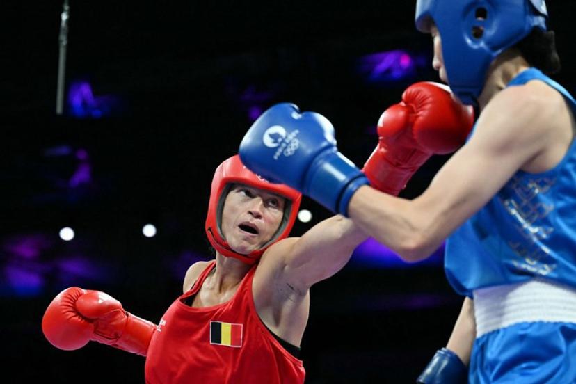 Belgium's Oshin Derieuw (L) fights against China's Yang Liu in the women's 66kg quarter-final boxing match during the Paris 2024 Olympic Games at the North Paris Arena, in Villepinte on August 3, 2024.  MOHD RASFAN / AFP