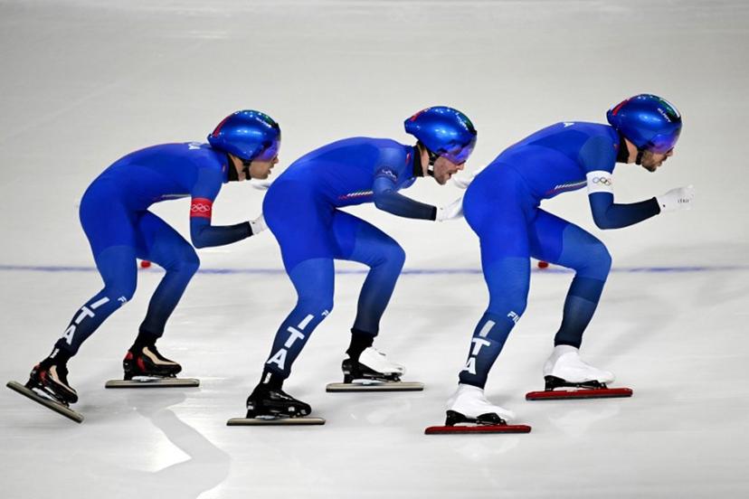 (From L) Italy's Andrea Giovannini, Italy's Michele Malfatti and Italy's Davide Ghiotto compete in the speed skating men's team pursuit semi-final during the Milano Cortina 2026 Winter Olympic Games at Milano Speed Skating Stadium in Milan on February 17, 2026.  Daniel MUNOZ / AFP