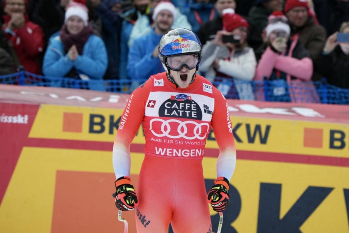 Switzerland's Marco Odermatt reacts in the finish area of the men's Alpine downhill race of the FIS Alpine Skiing World Cup in Wengen, on January 17, 2026.  Dimitar DILKOFF / AFP