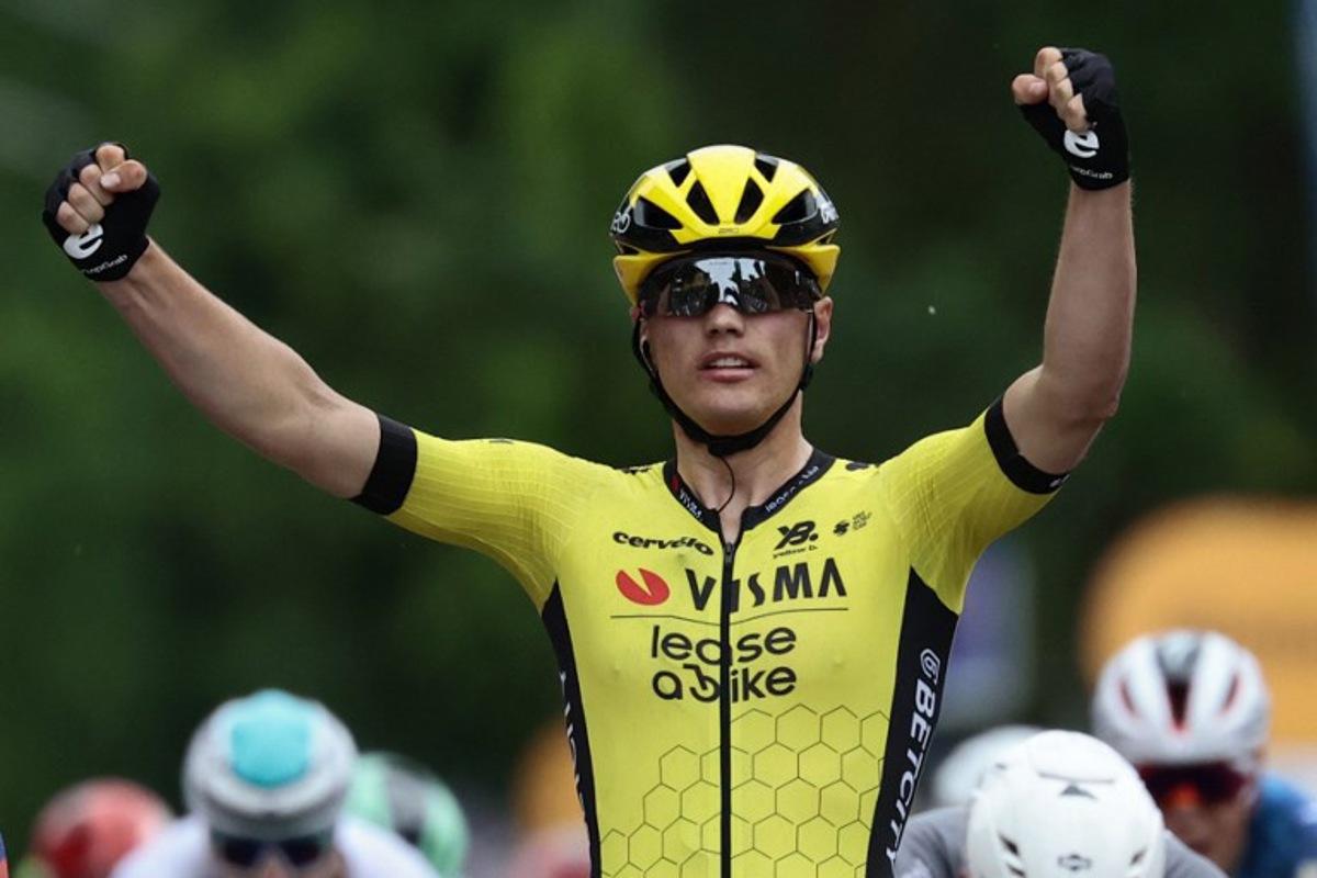 Team Visma-Lease a Bike's Dutch rider Olav Kooij celebrates after victory as he crosses the finish of the 12th stage of the 108th Giro d'Italia cycling race 172kms from Modena to Viadana on May 22, 2025.  Luca Bettini / AFP