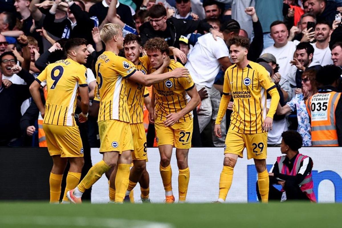 Brighton's Belgian defender #29 Maxim De Cuyper (R) celebrates scoring the team's second goal during the English Premier League football match between Chelsea and Brighton and Hove Albion at Stamford Bridge in London on September 27, 2025.  HENRY NICHOLLS / AFP